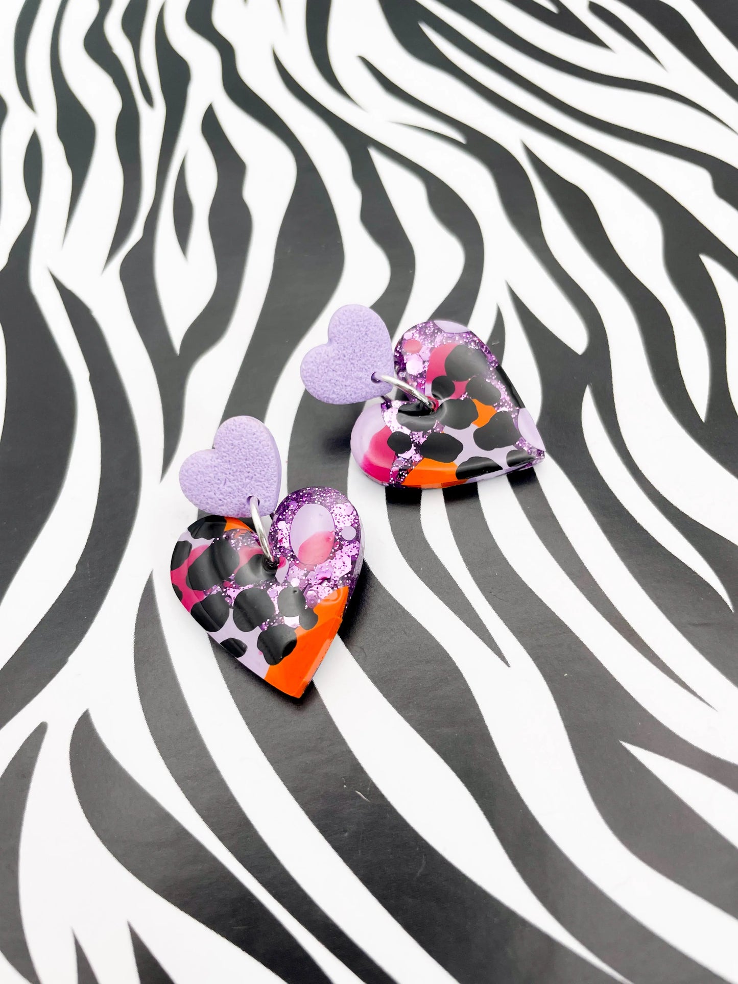 Lilac, Orange and Hot Pink Giraffe Print Glitter Resin Heart Dangle Earrings from Sapphire Frills