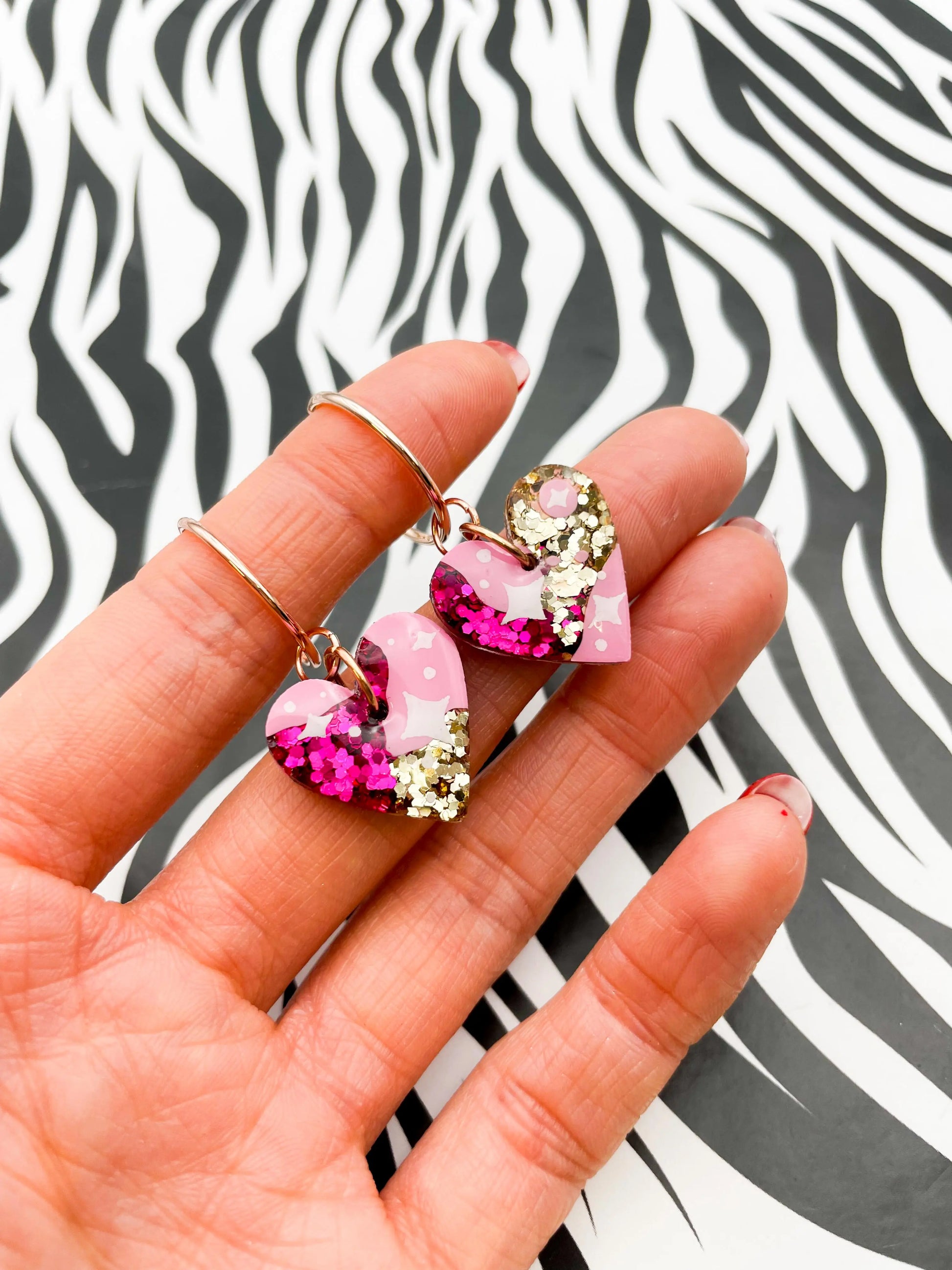 Medium Hot Pink and Gold Glitter Star Print Resin Heart Earrings from Sapphire Frills