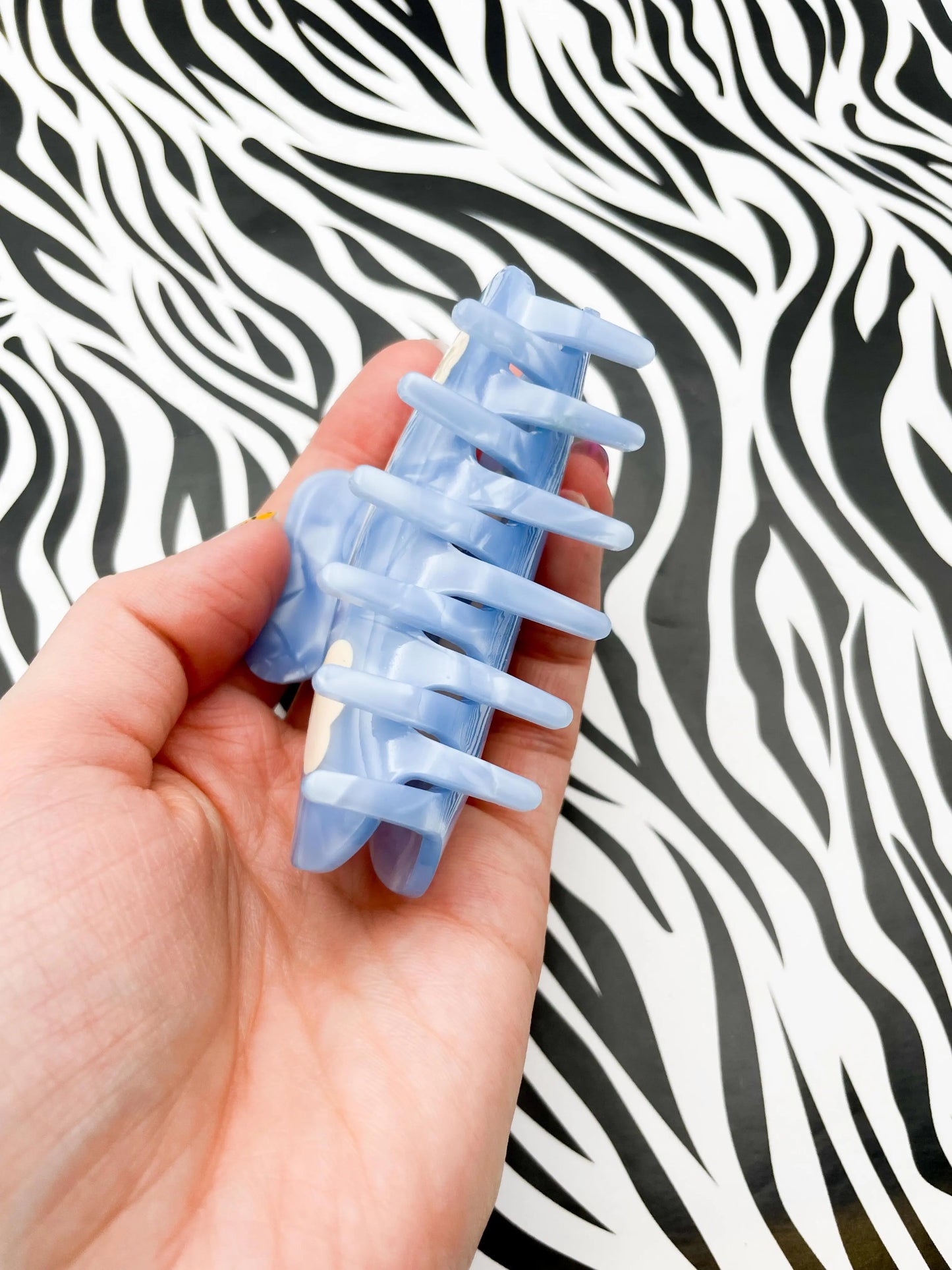 Medium Metallic Sky Blue Cloud Print Claw Hair Clip from Sapphire Frills