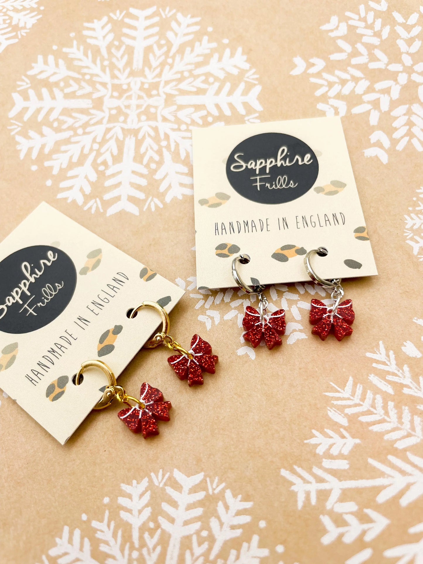 Mini Red Glitter Acrylic Xmas Bow Dangle Earrings from Sapphire Frills