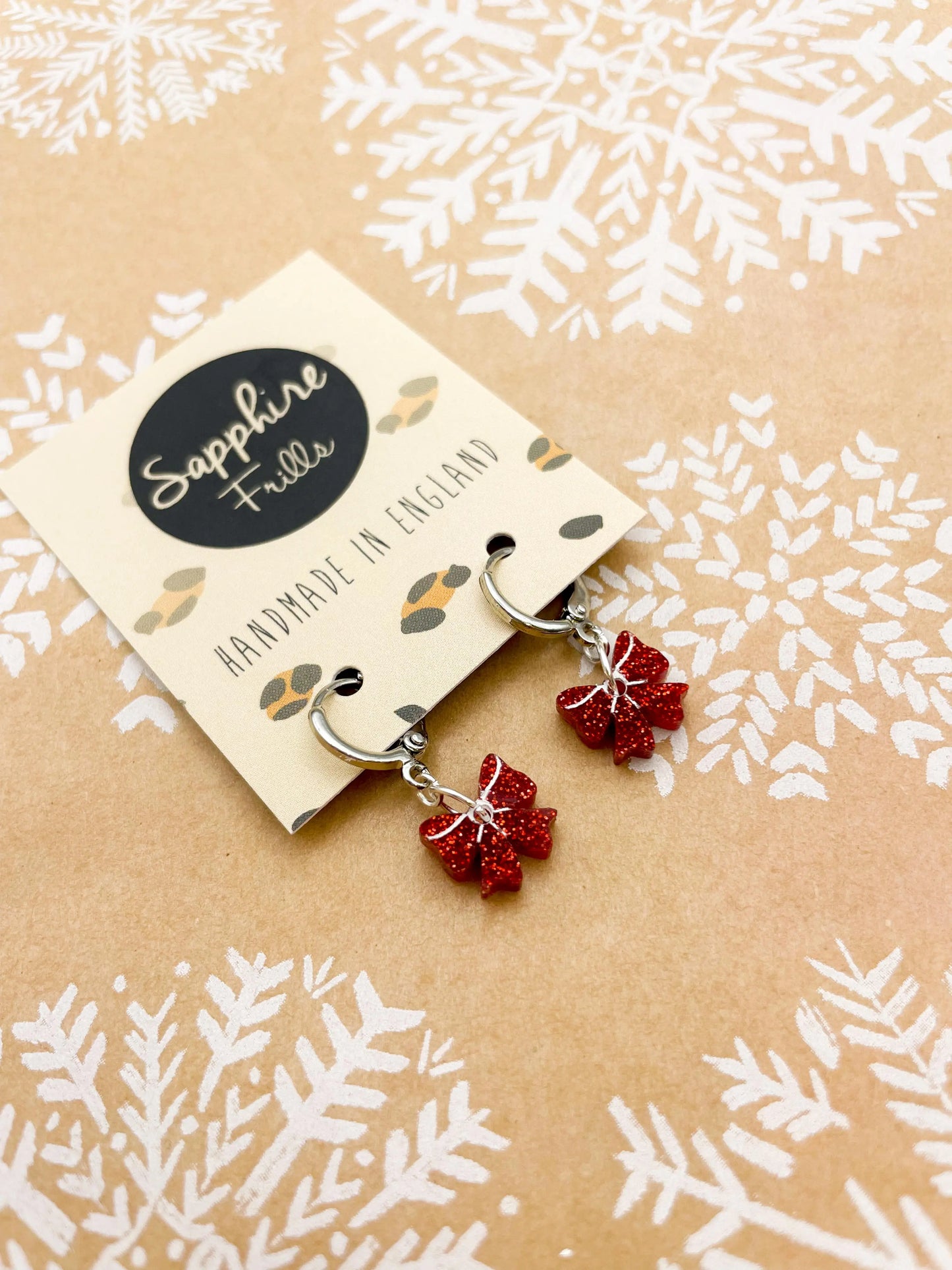 Mini Red Glitter Acrylic Xmas Bow Dangle Earrings from Sapphire Frills