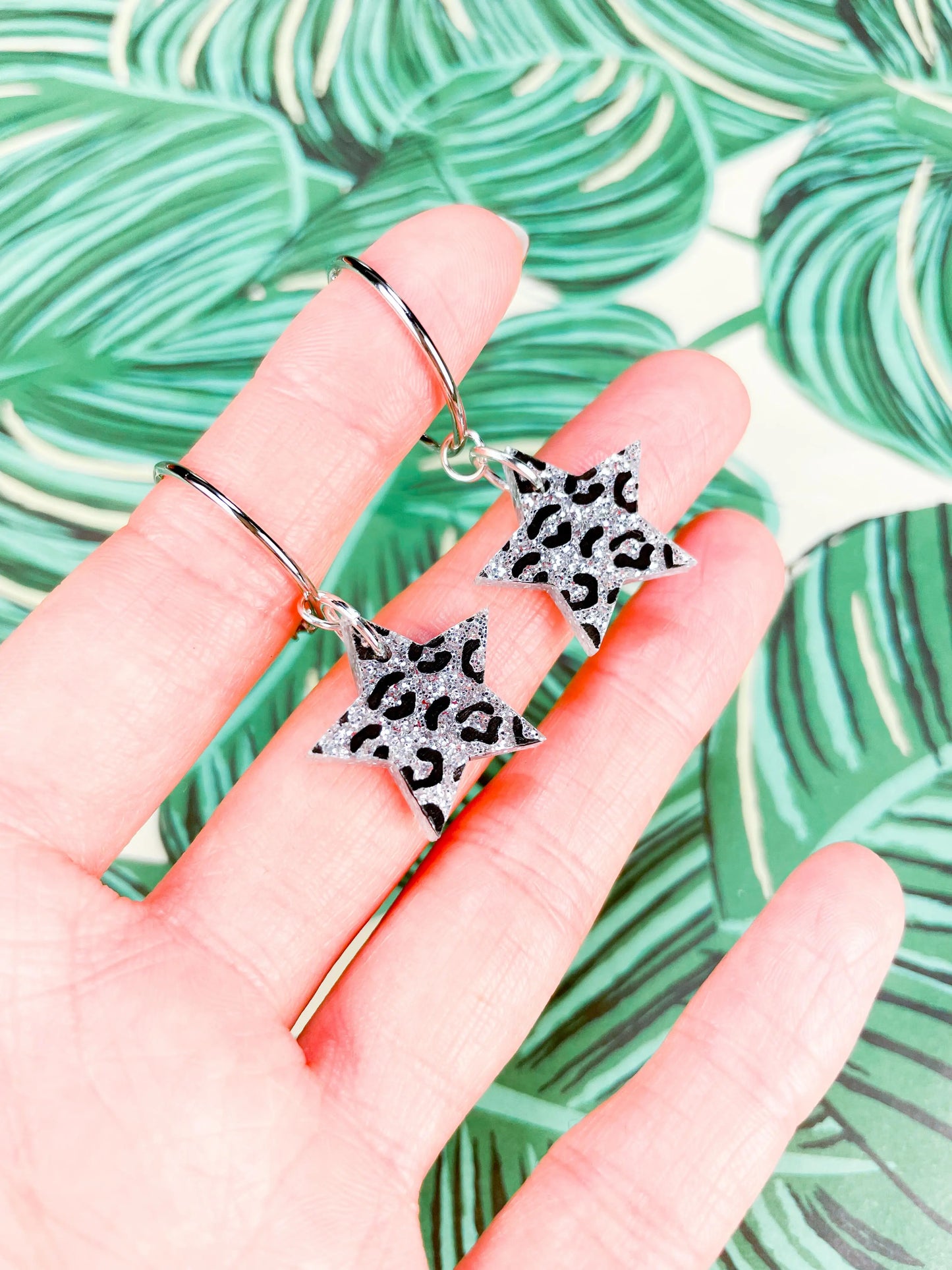 Medium Holographic Silver Glitter Leopard Print Acrylic Star Dangle Earrings from Sapphire Frills