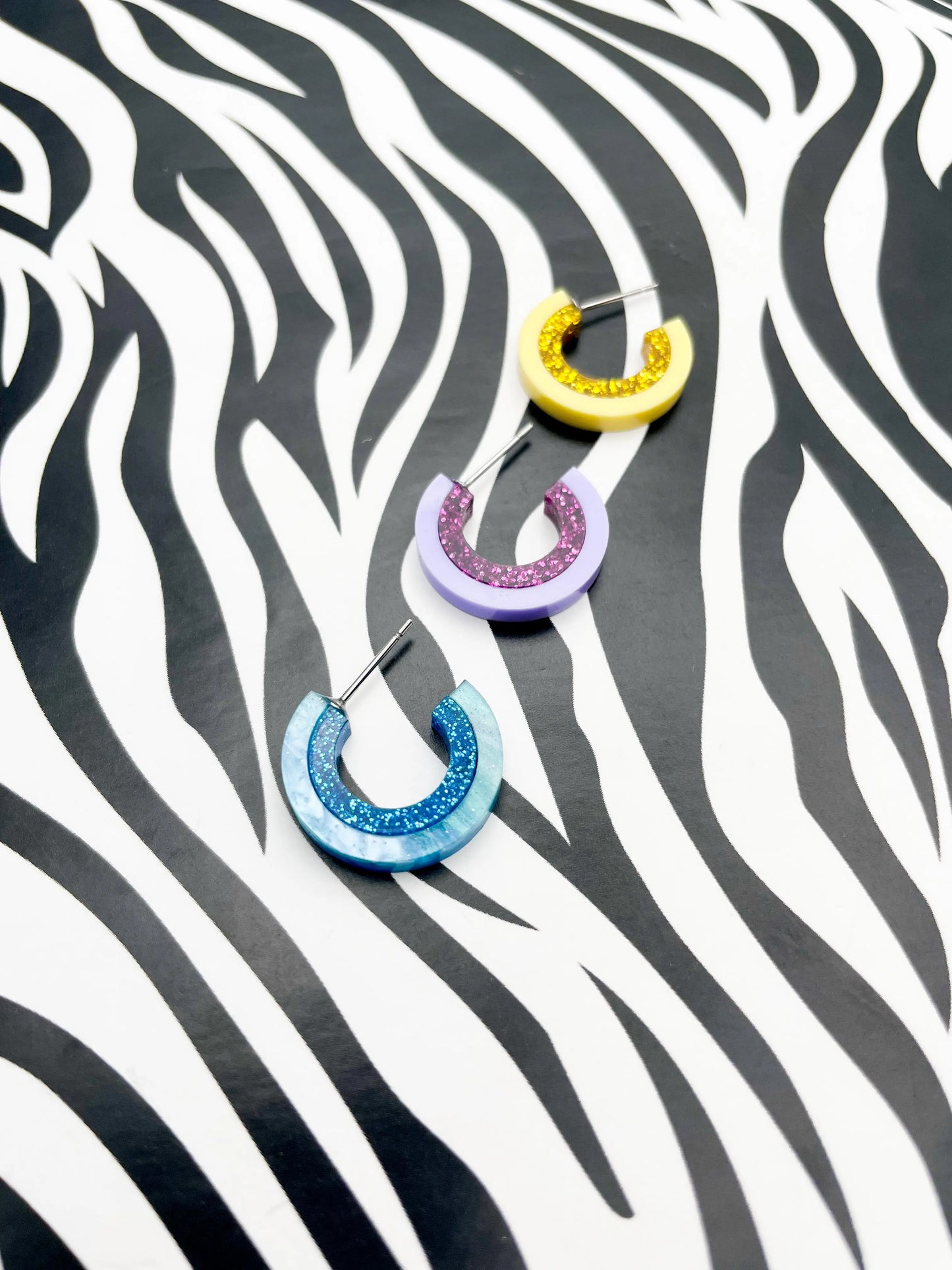 Pastel Lilac and Purple Glitter Striped Acrylic Hoops from Sapphire Frills