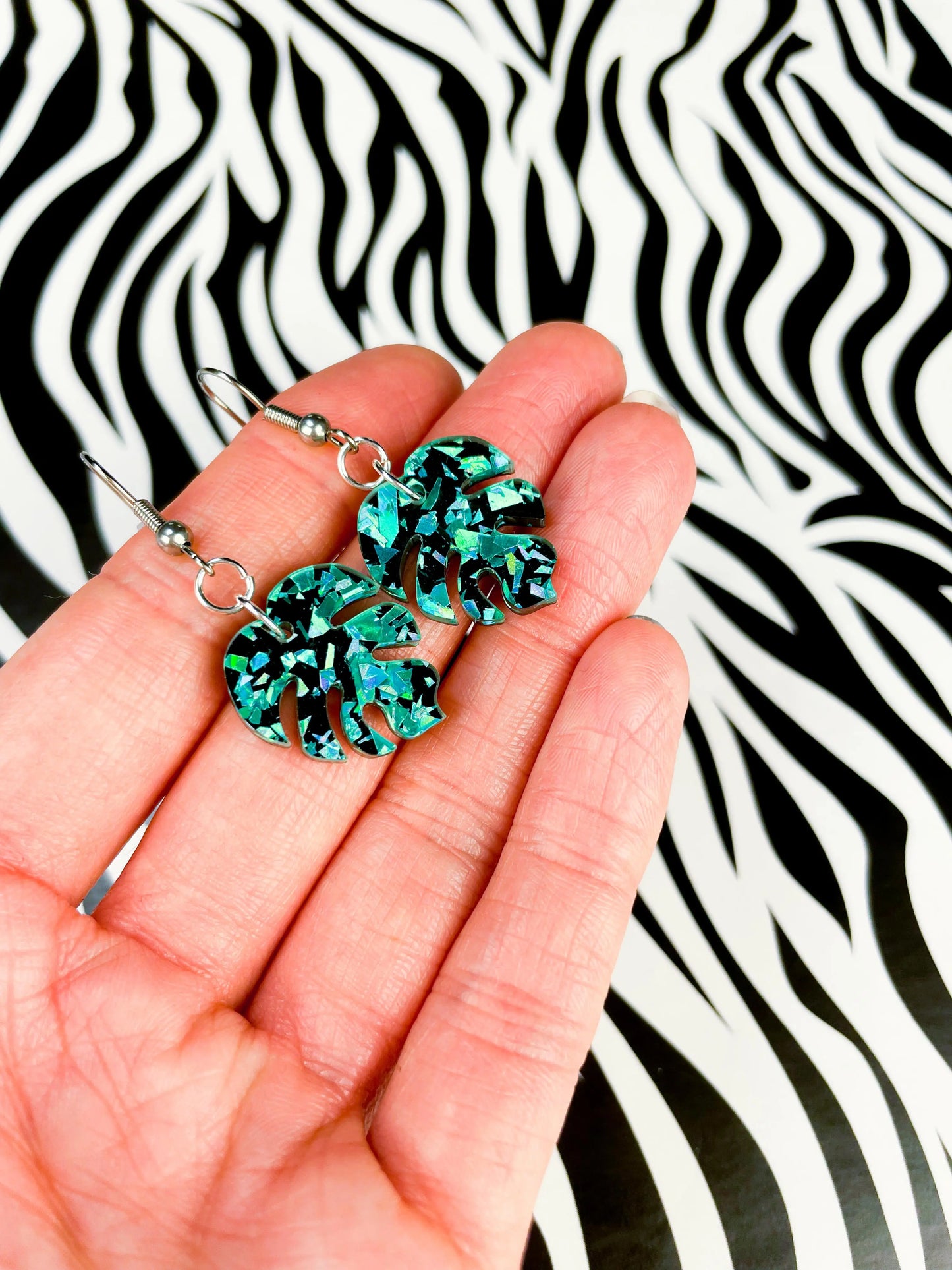 Small Teal Chunky Crystal Glitter Acrylic Monstera Leaf Dangle Earrings from Sapphire Frills