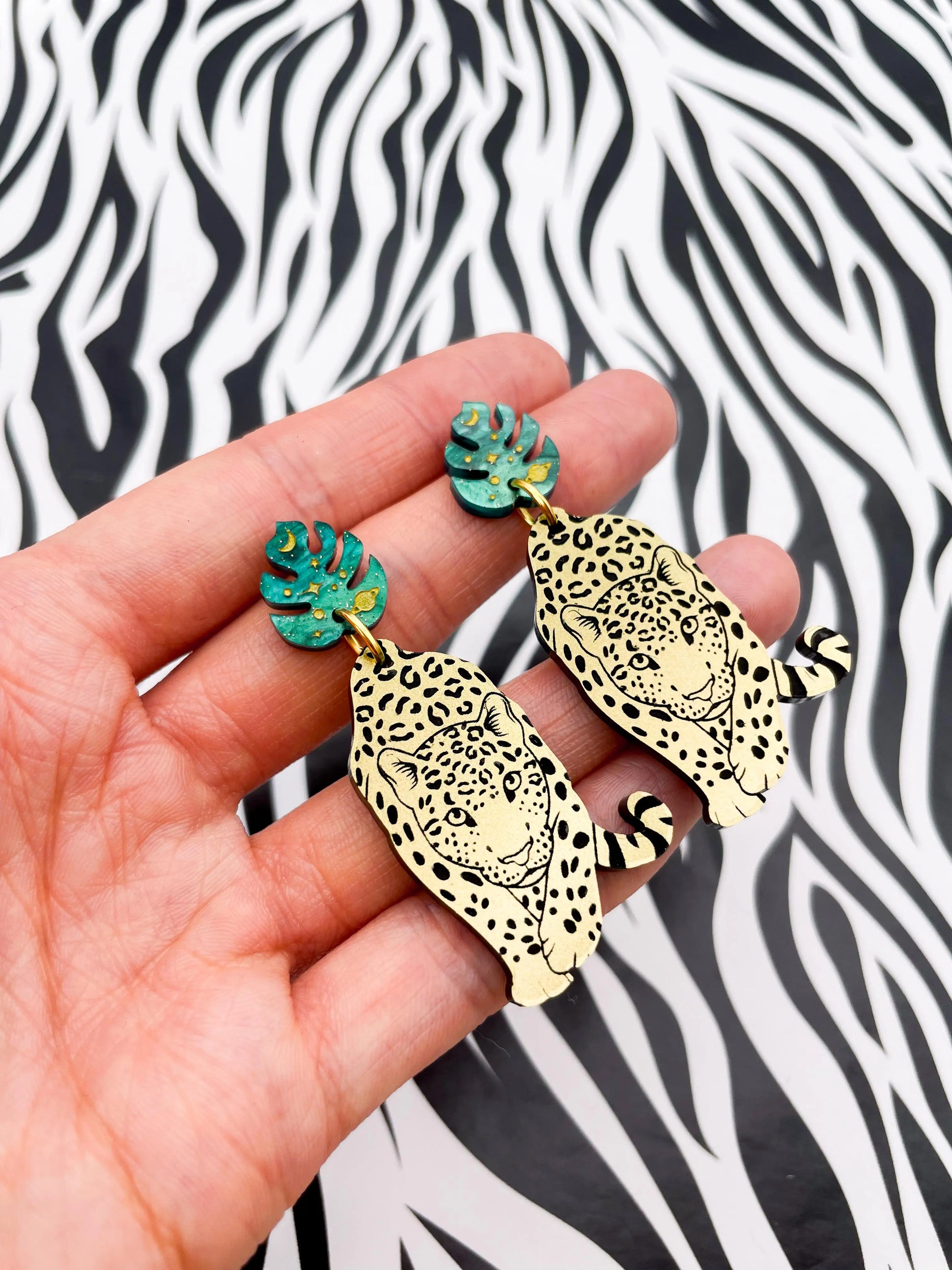 Green Galaxy Glitter Marble and Gold Acrylic Leopard Monstera Leaf Dangle Earrings from Sapphire Frills