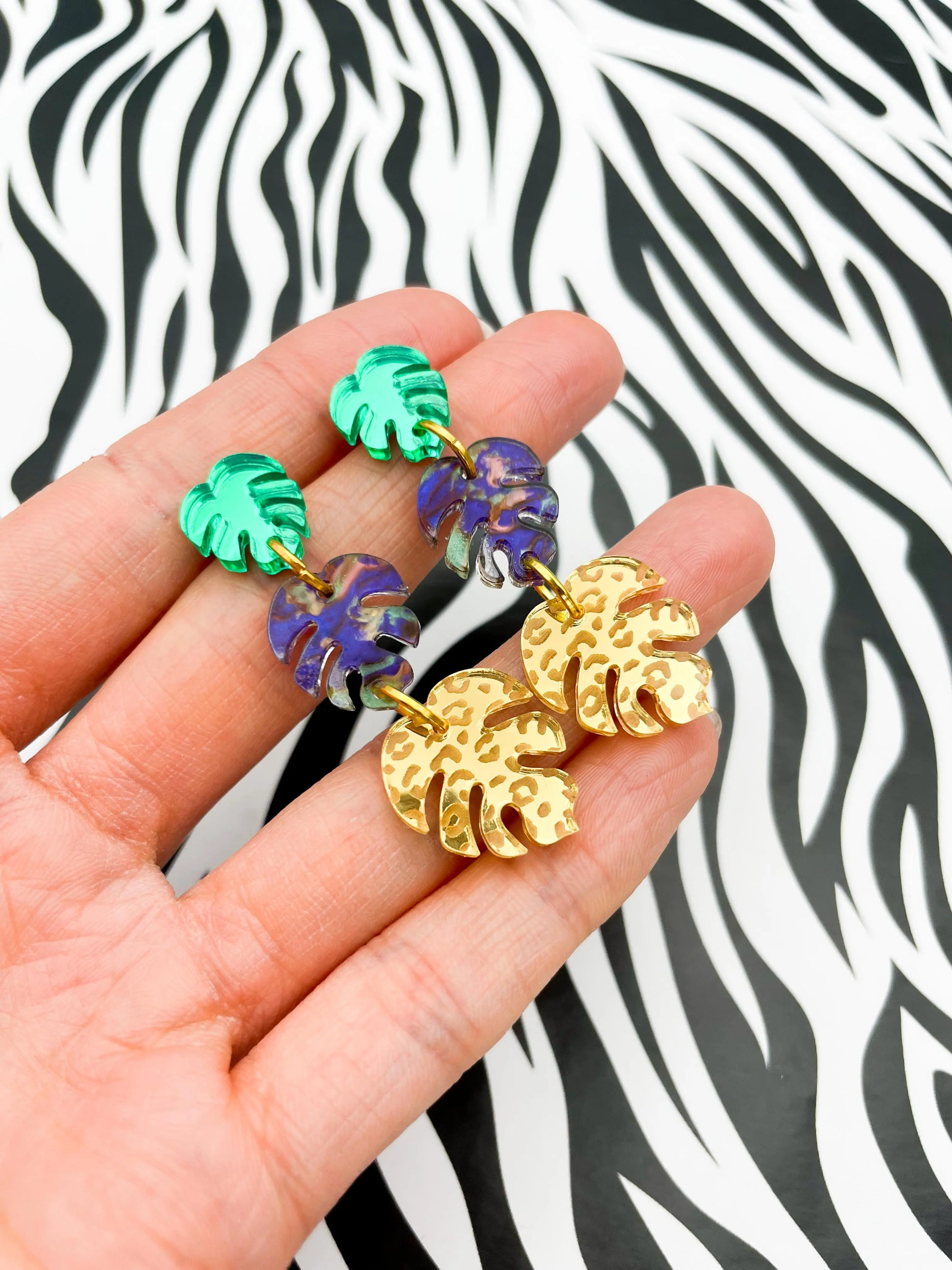 Green, Jungle Blue & Gold Leopard Acrylic Mirror Monstera Leaf Dangle Earrings from Sapphire Frills