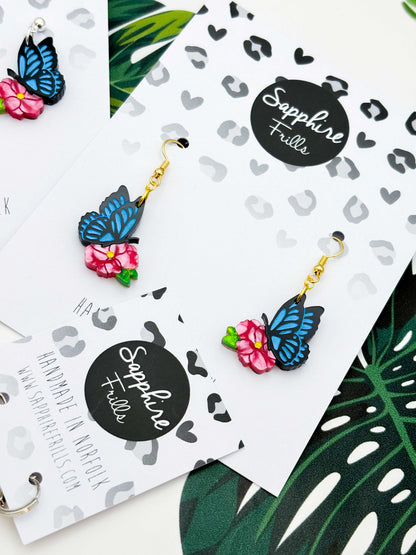 Medium Blue Butterfly on Hot Pink Flower Dangle Earrings or Necklace – Hypoallergenic Stainless Steel