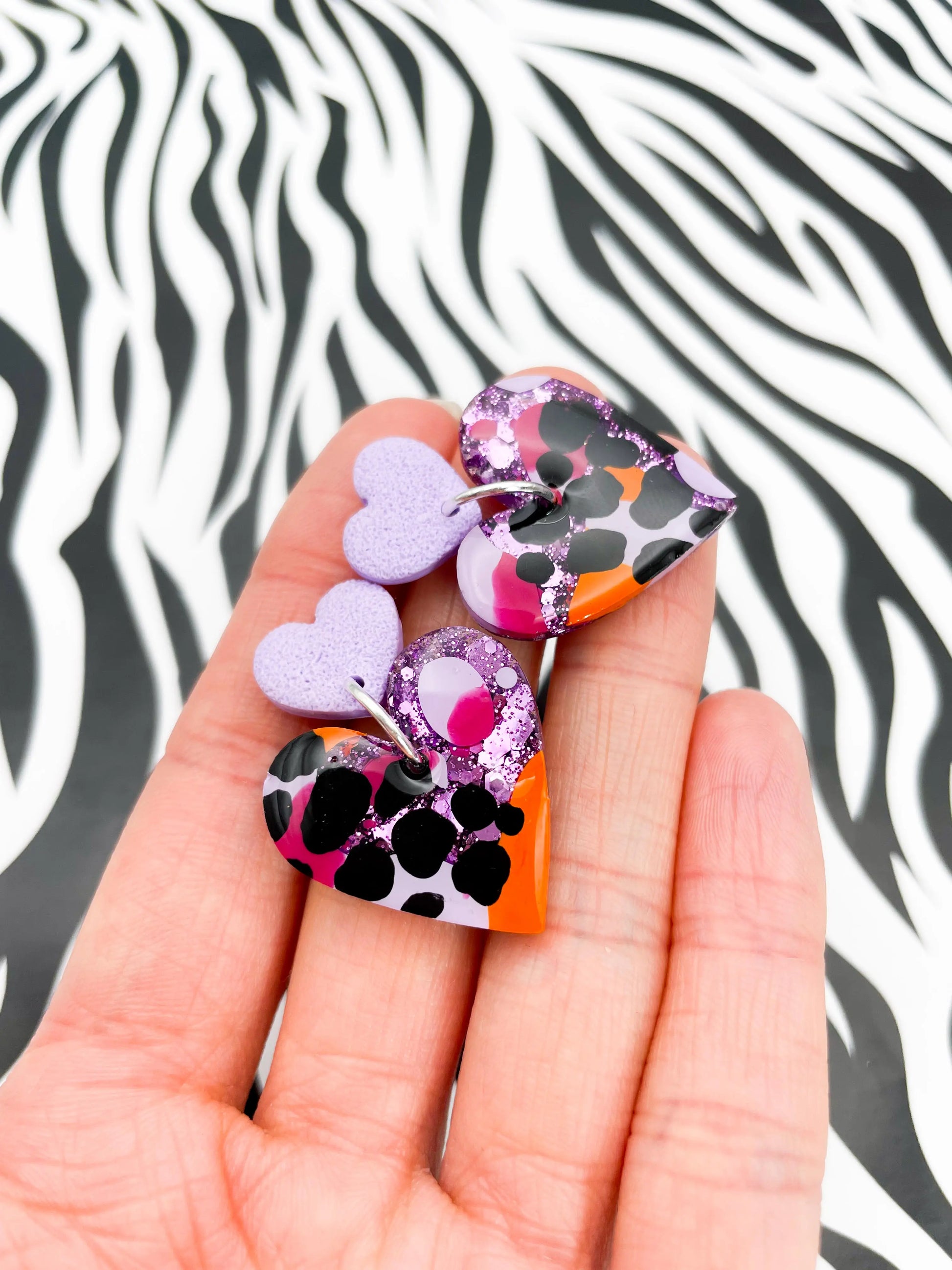 Lilac, Orange and Hot Pink Giraffe Print Glitter Resin Heart Dangle Earrings from Sapphire Frills