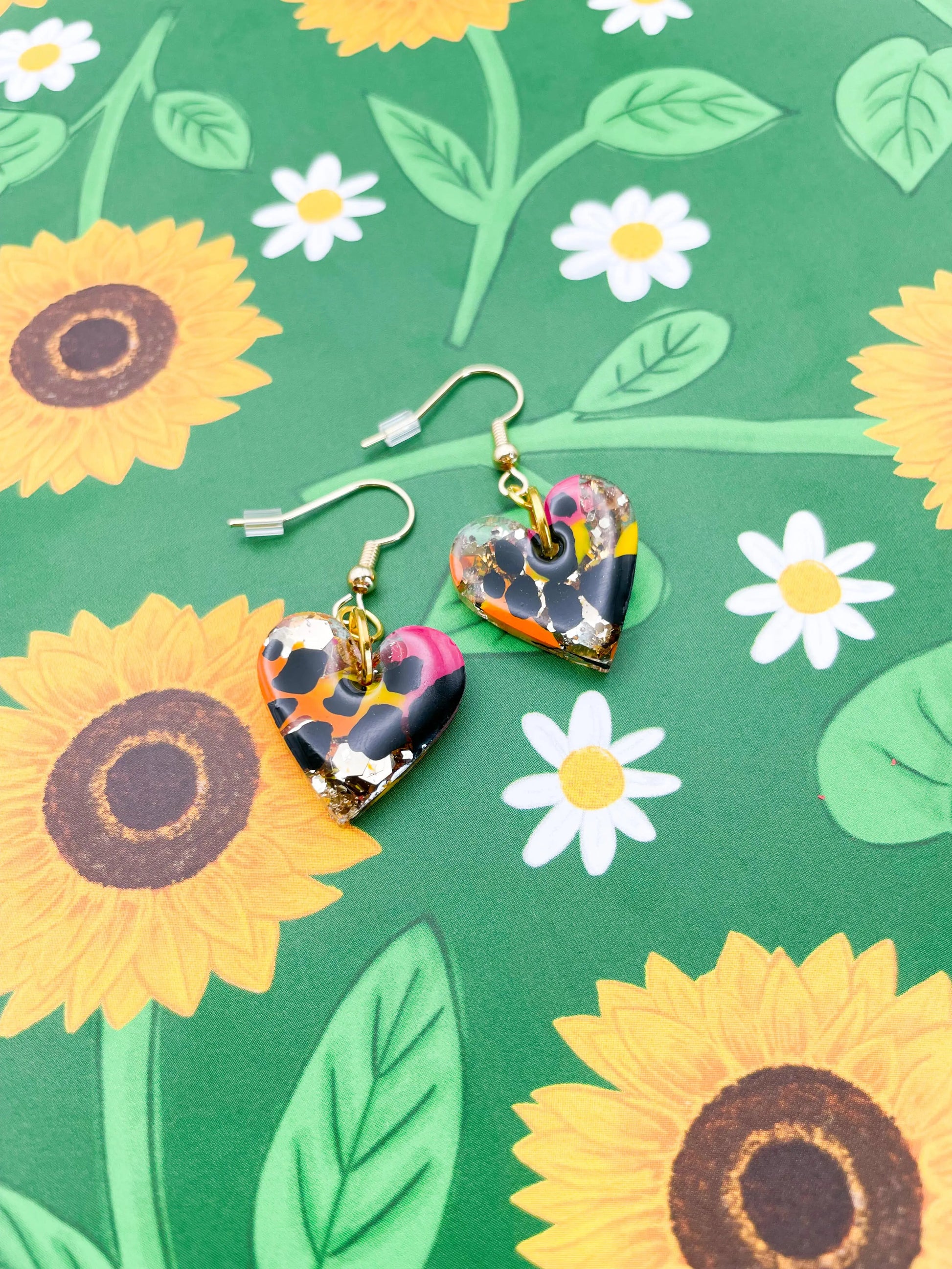 Medium Safari Giraffe Print Gold Glitter Resin Heart Stud Earrings from Sapphire Frills