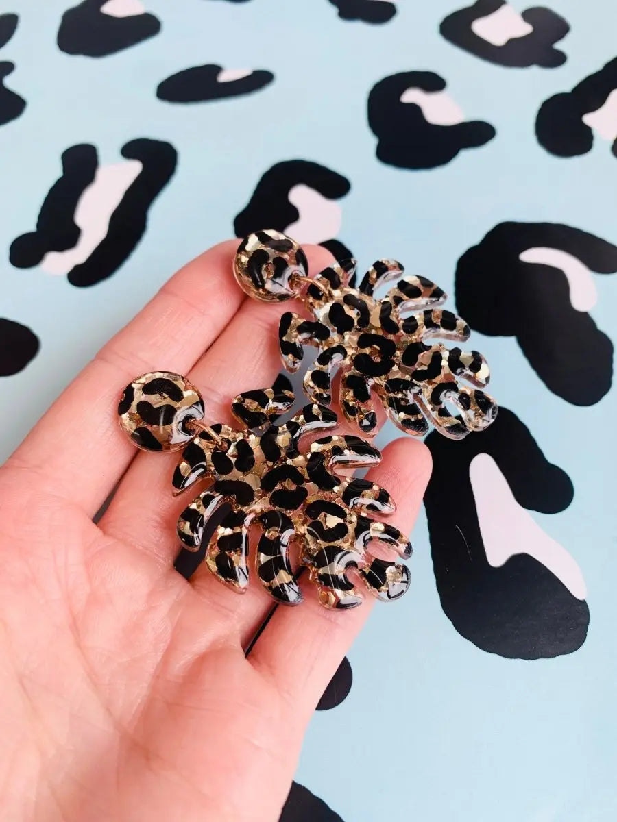 Gold Glitter Leopard Print Monstera Leaf Dangle Earrings from Sapphire Frills
