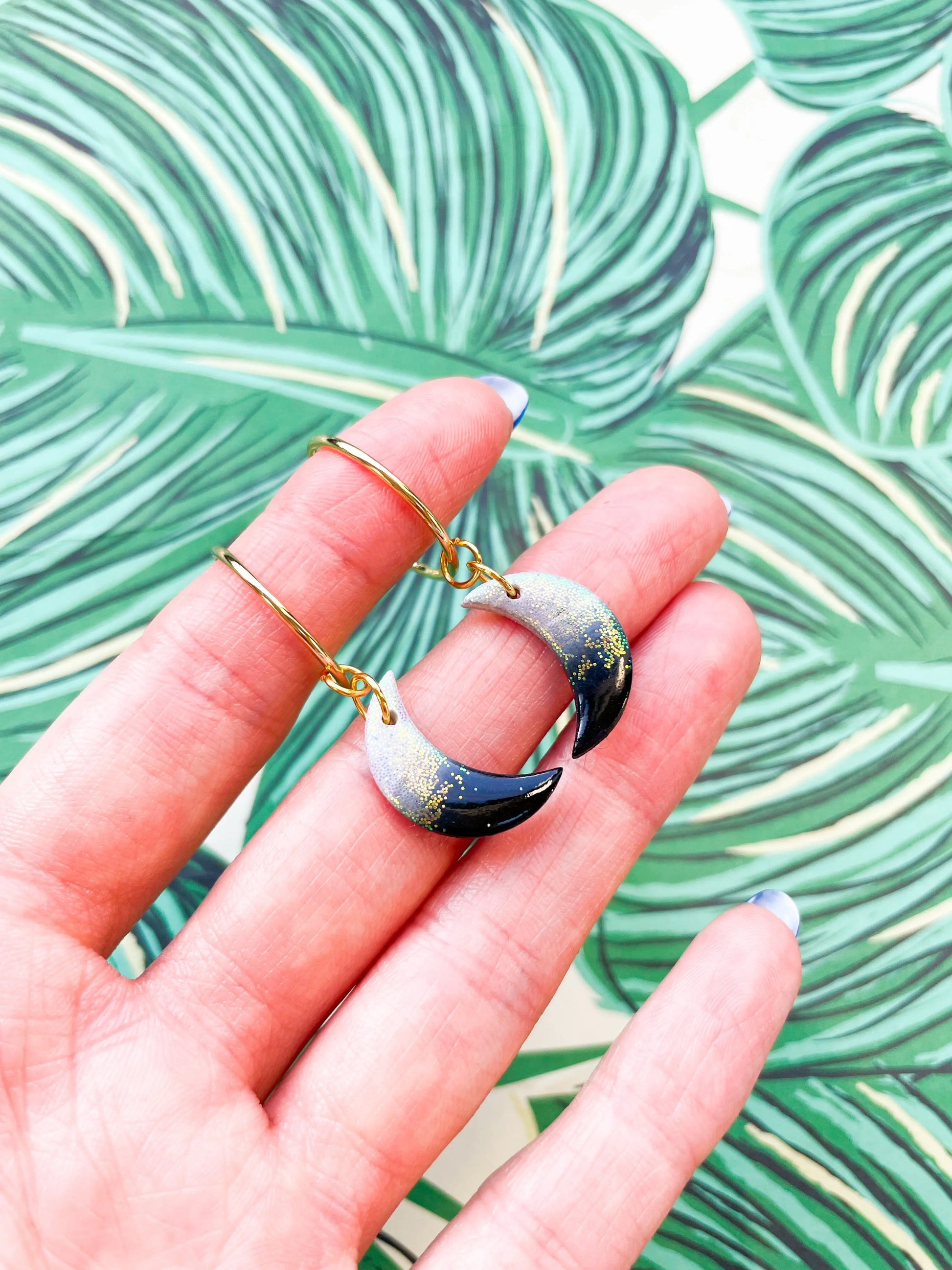 Medium Florescent White Glitter and Black Ombre Moon Earrings from Sapphire Frills