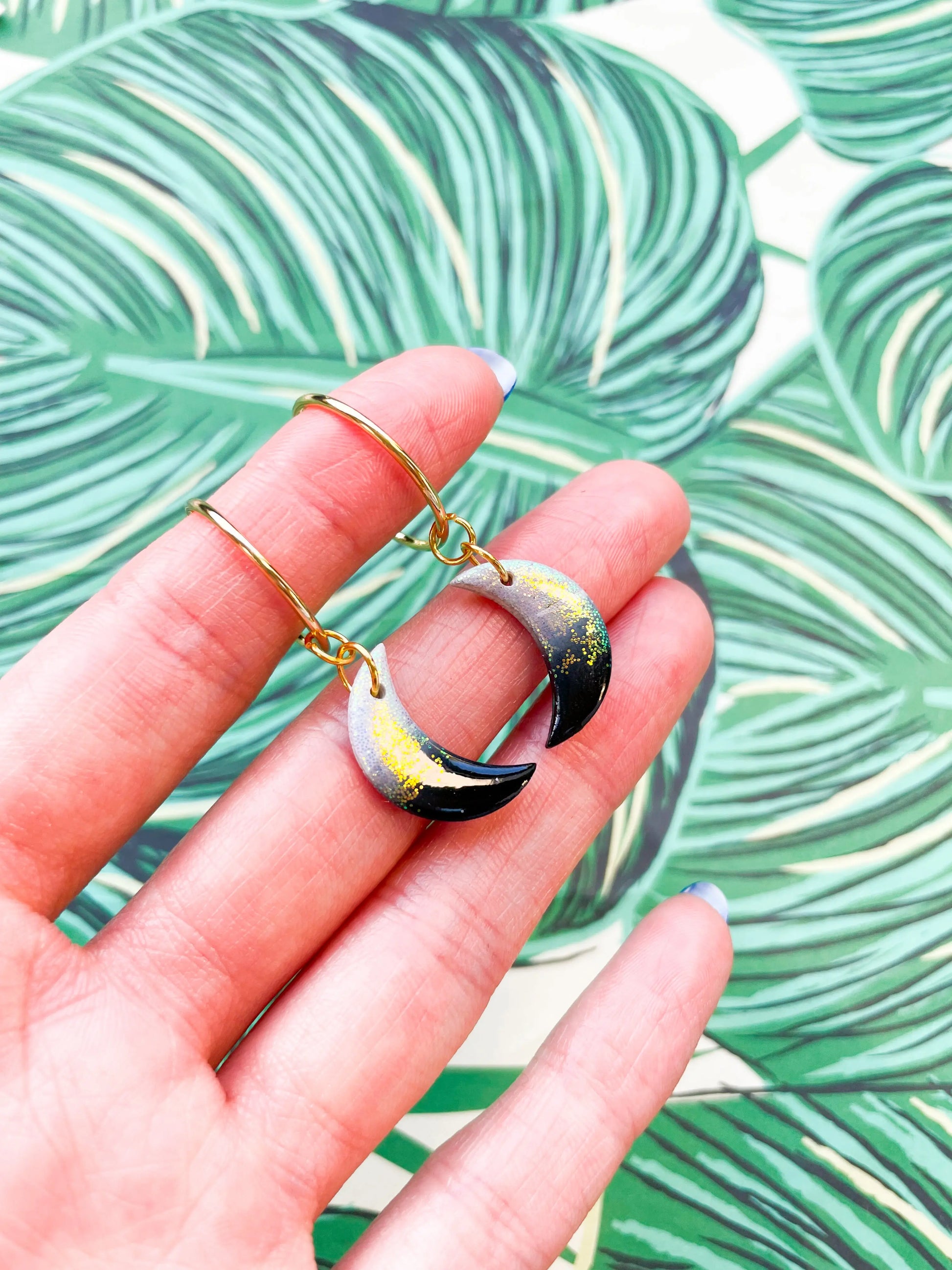 Medium Florescent White Glitter and Black Ombre Moon Earrings from Sapphire Frills