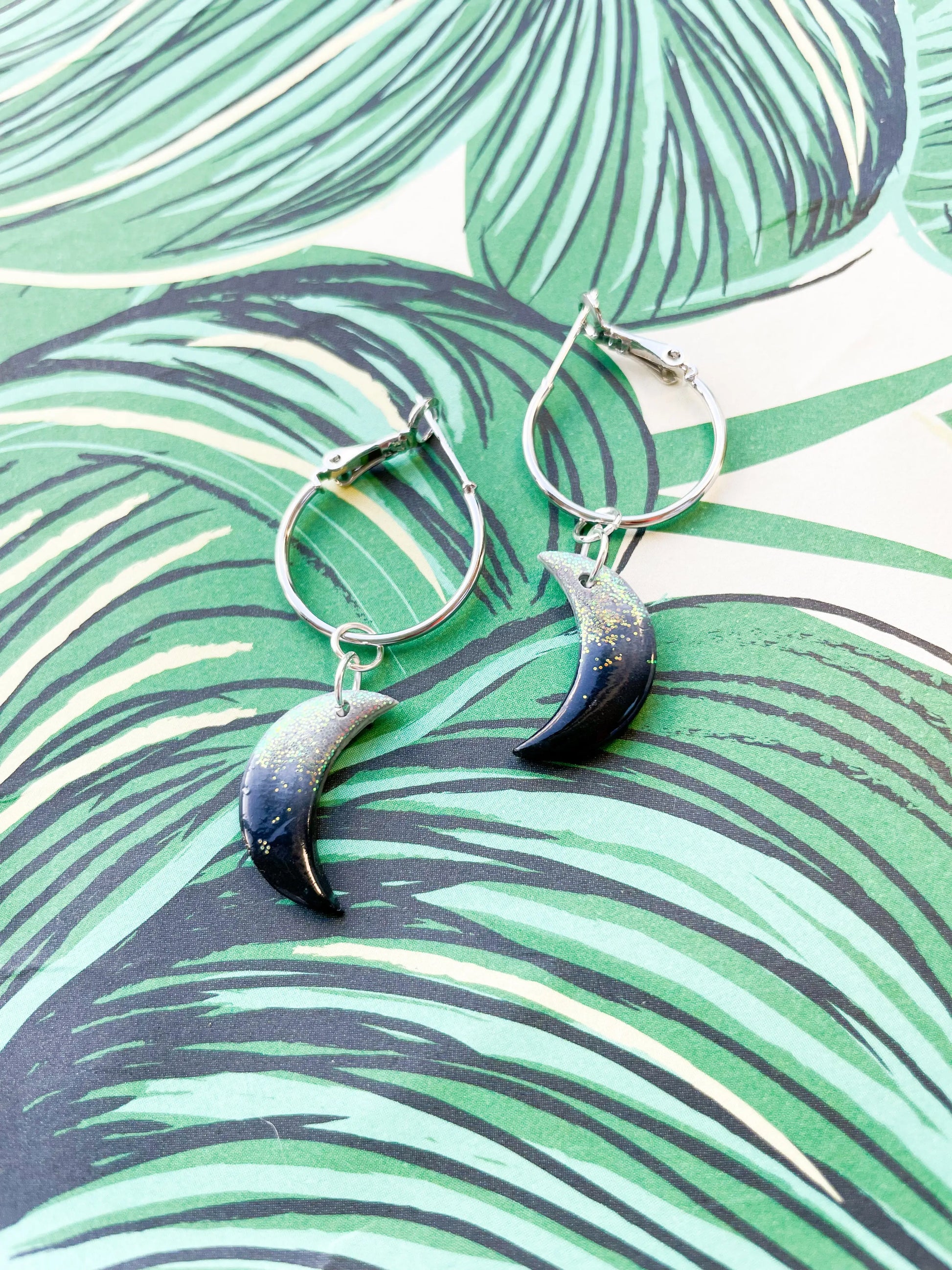 Medium Florescent White Glitter and Black Ombre Moon Earrings from Sapphire Frills