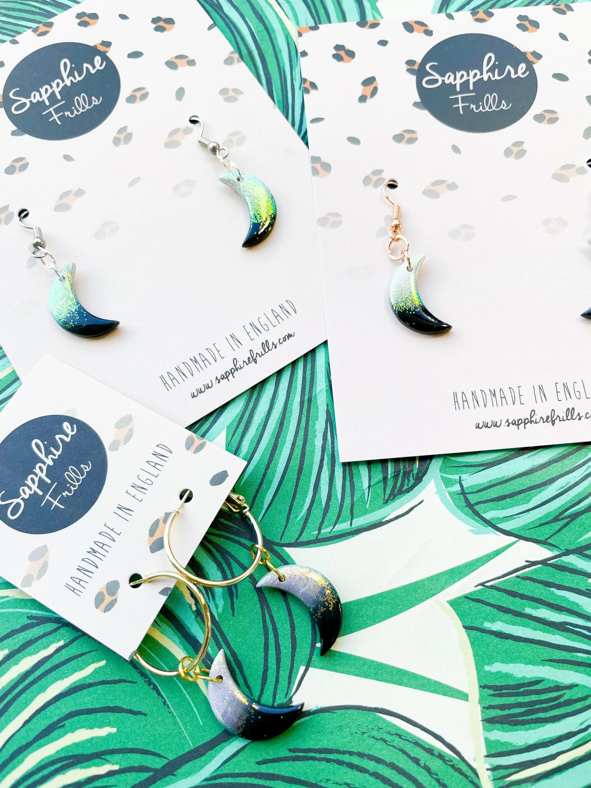 Medium Florescent White Glitter and Black Ombre Moon Earrings from Sapphire Frills