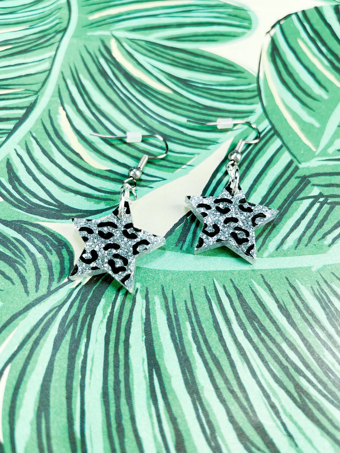 Medium Holographic Silver Glitter Leopard Print Acrylic Star Dangle Earrings from Sapphire Frills