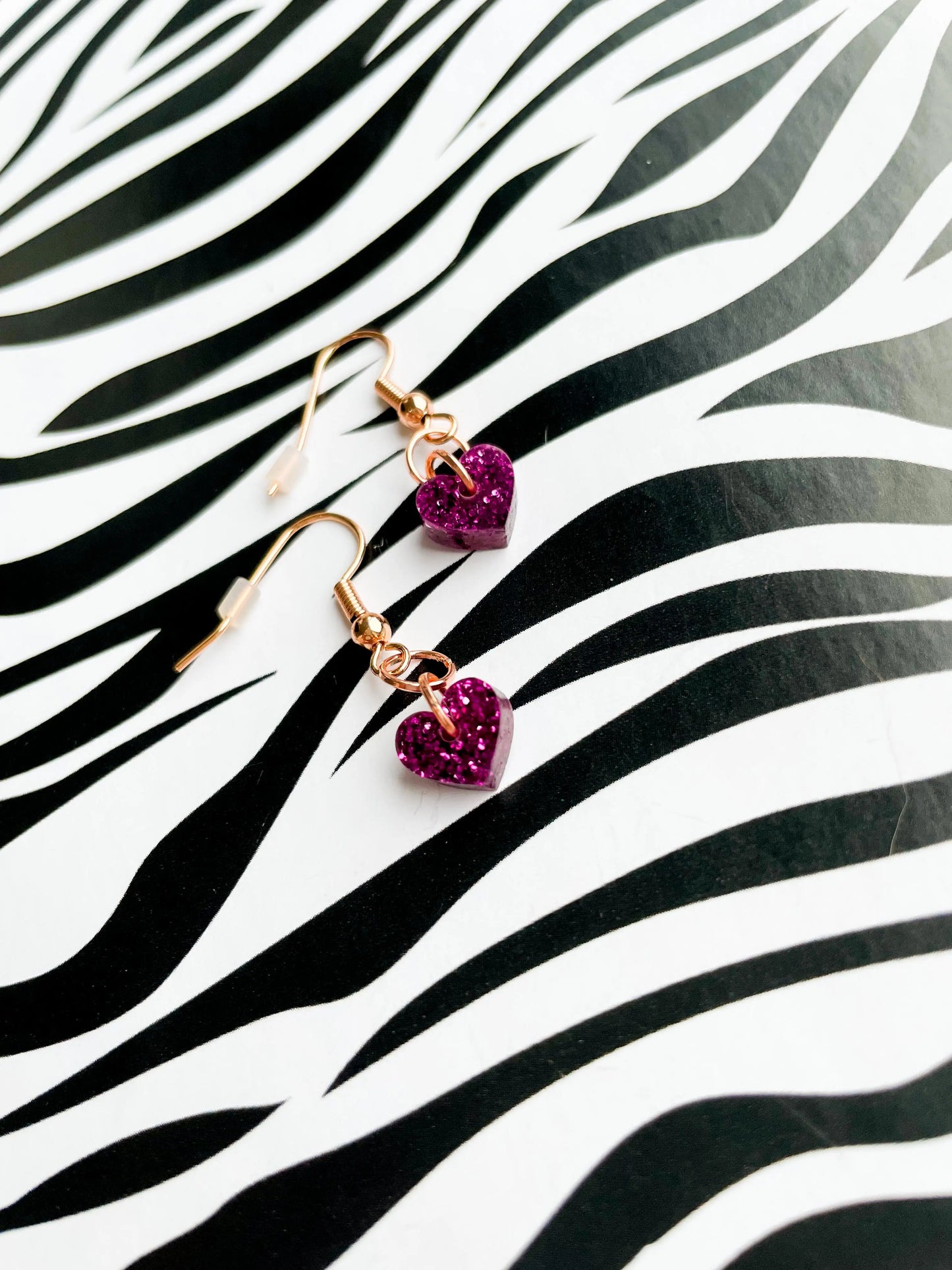 Mini Dark Purpley Pink Glitter Acrylic Heart Dangle Earrings from Sapphire Frills