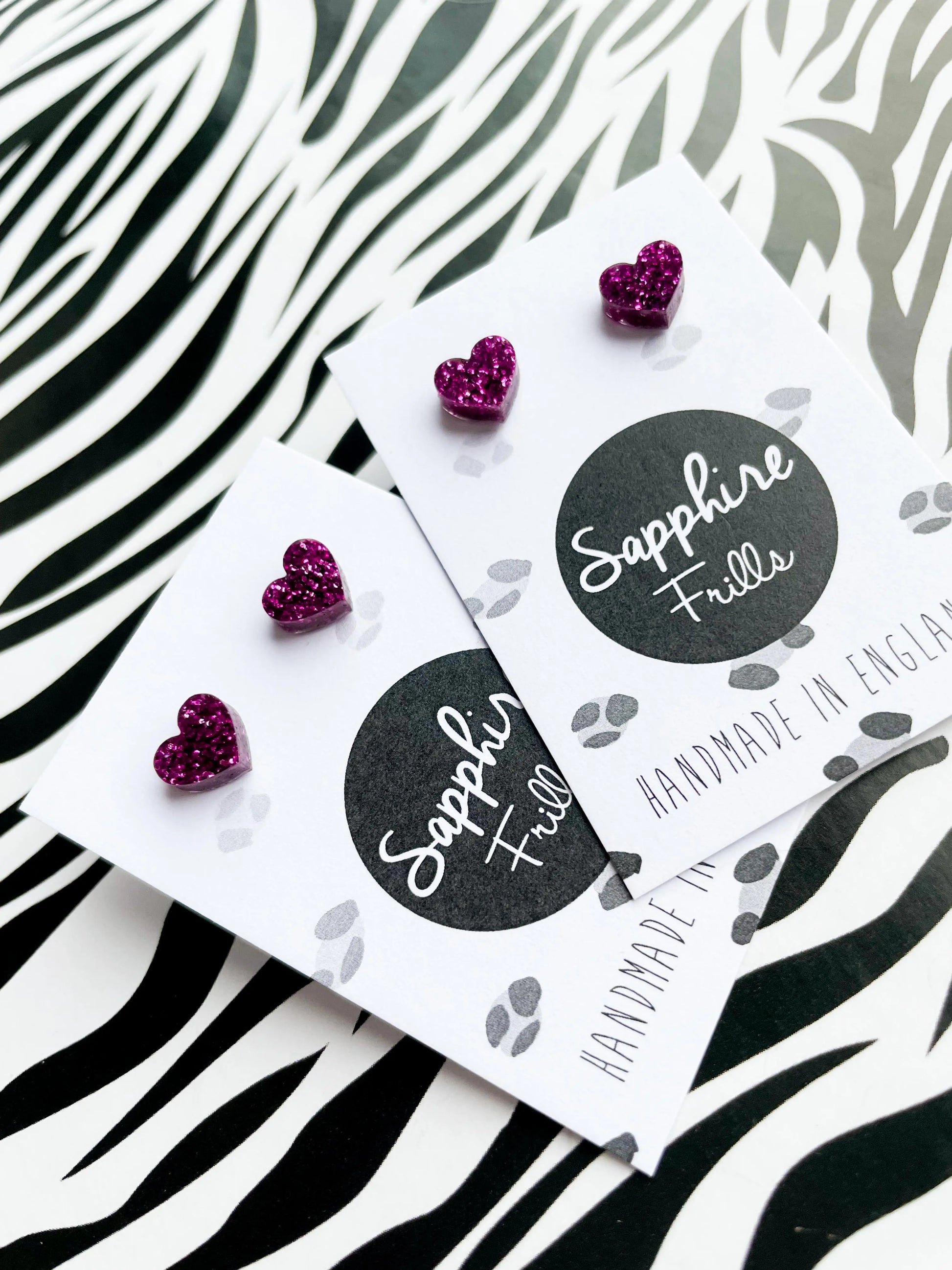 Mini Dark Purpley Pink Glitter Acrylic Heart Studs from Sapphire Frills