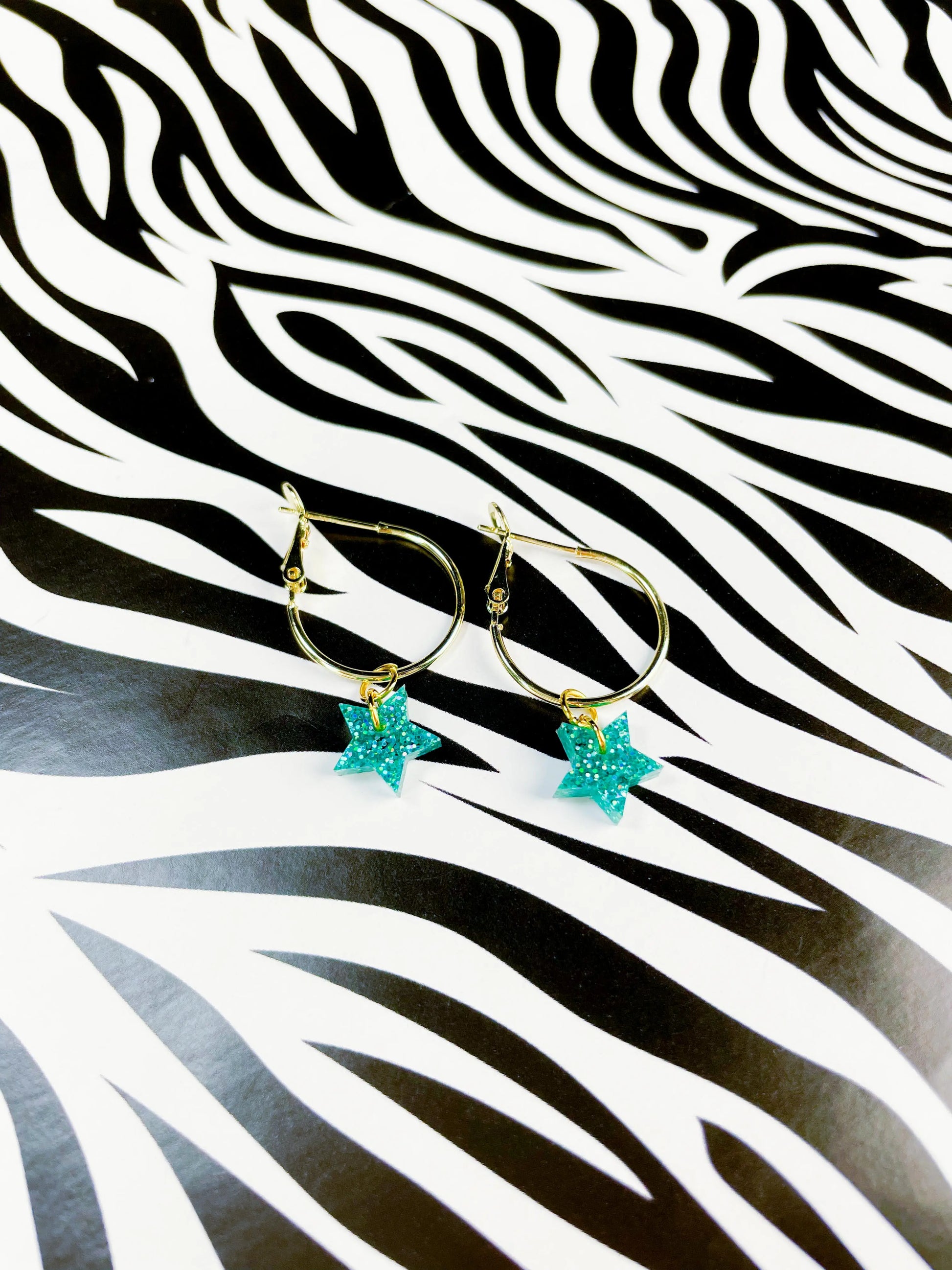 Mini Teal Luxe Glitter Acrylic Star Dangle Earrings from Sapphire Frills