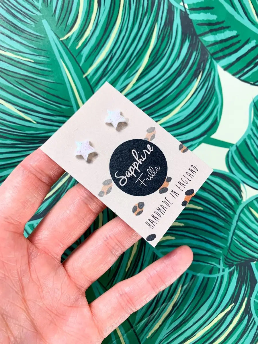 Mini White Florescent Glitter Star Stud Earrings from Sapphire Frills