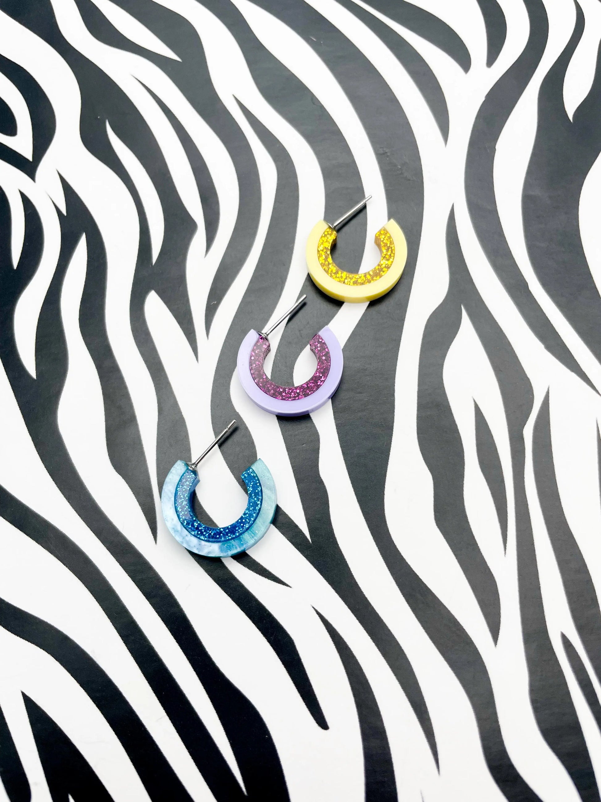 Pastel Lilac and Purple Glitter Striped Acrylic Hoops from Sapphire Frills