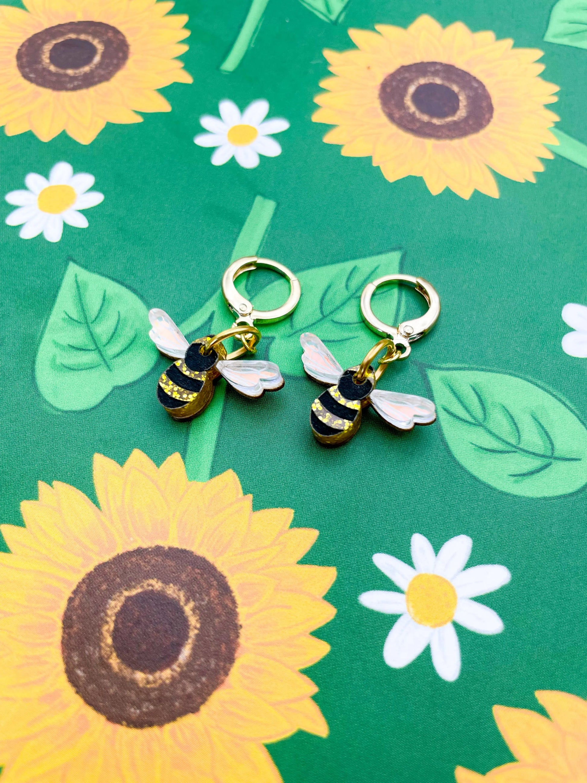 Small Gold Glitter and Iridescent Blue Acrylic Bee Dangle Earrings from Sapphire Frills