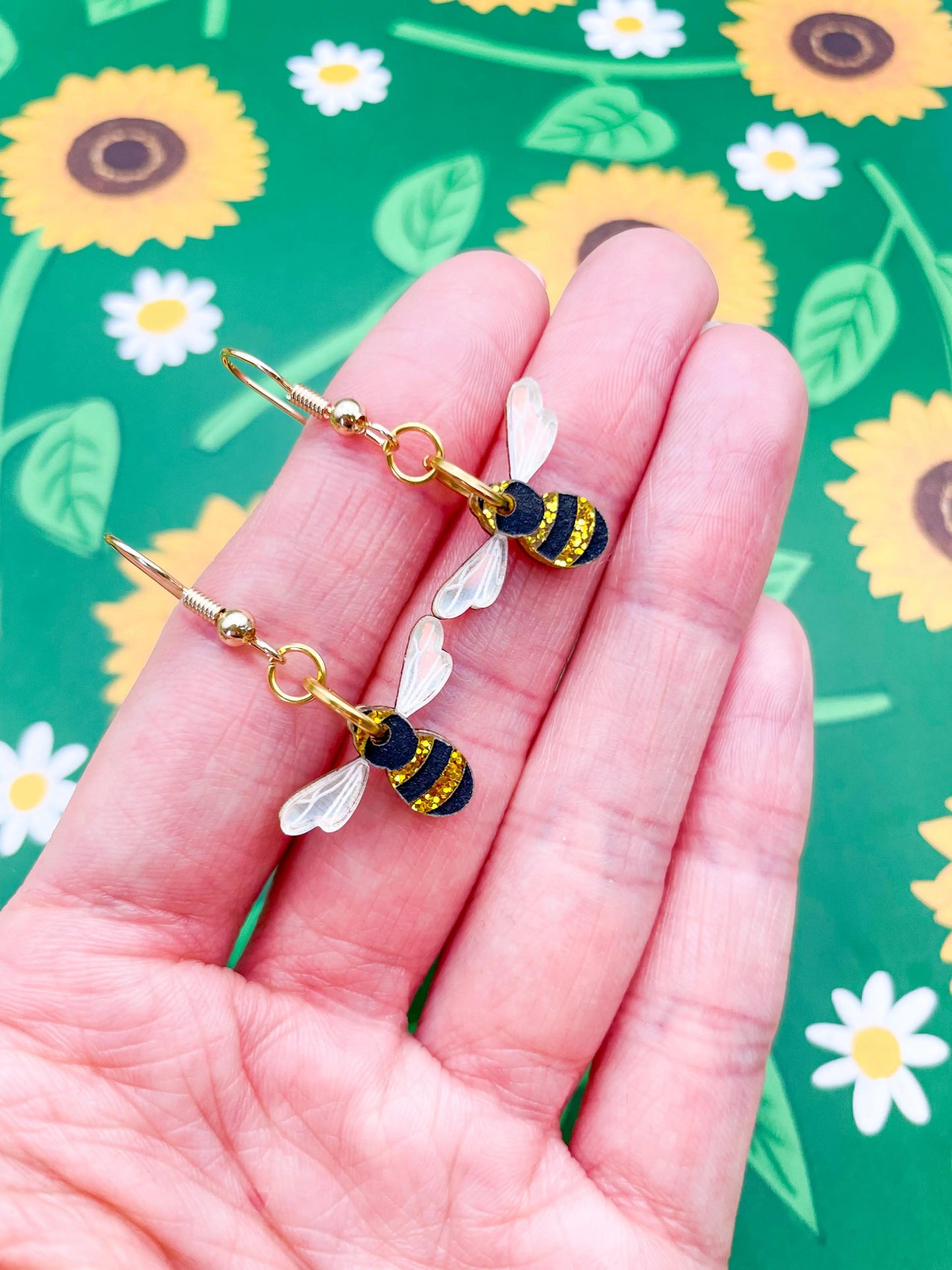 Small Gold Glitter and Iridescent Blue Acrylic Bee Dangle Earrings from Sapphire Frills