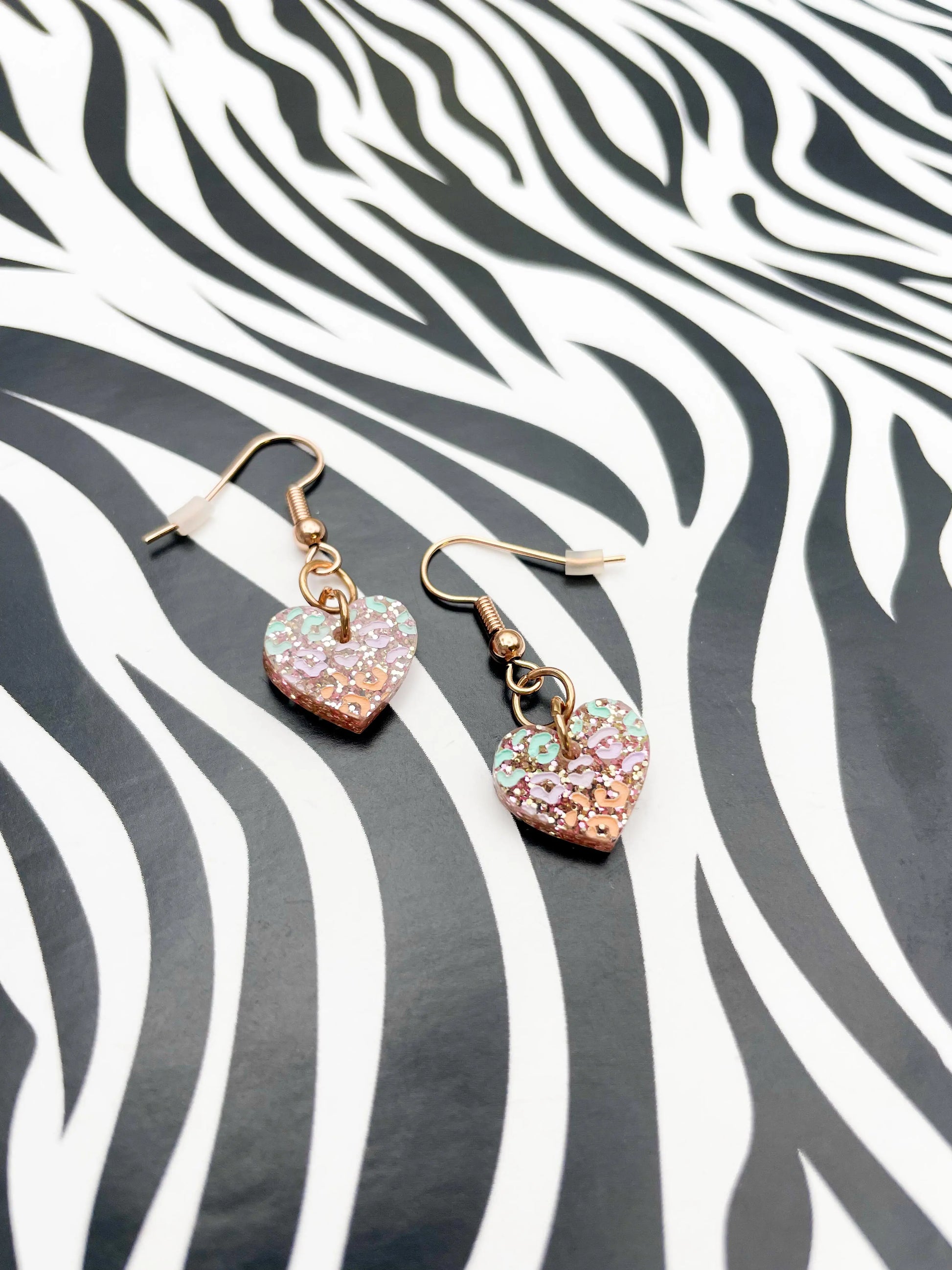 Small Rose Glitter, Mint, Lilac and Peach Leopard Print Acrylic Heart Dangle Earrings from Sapphire Frills