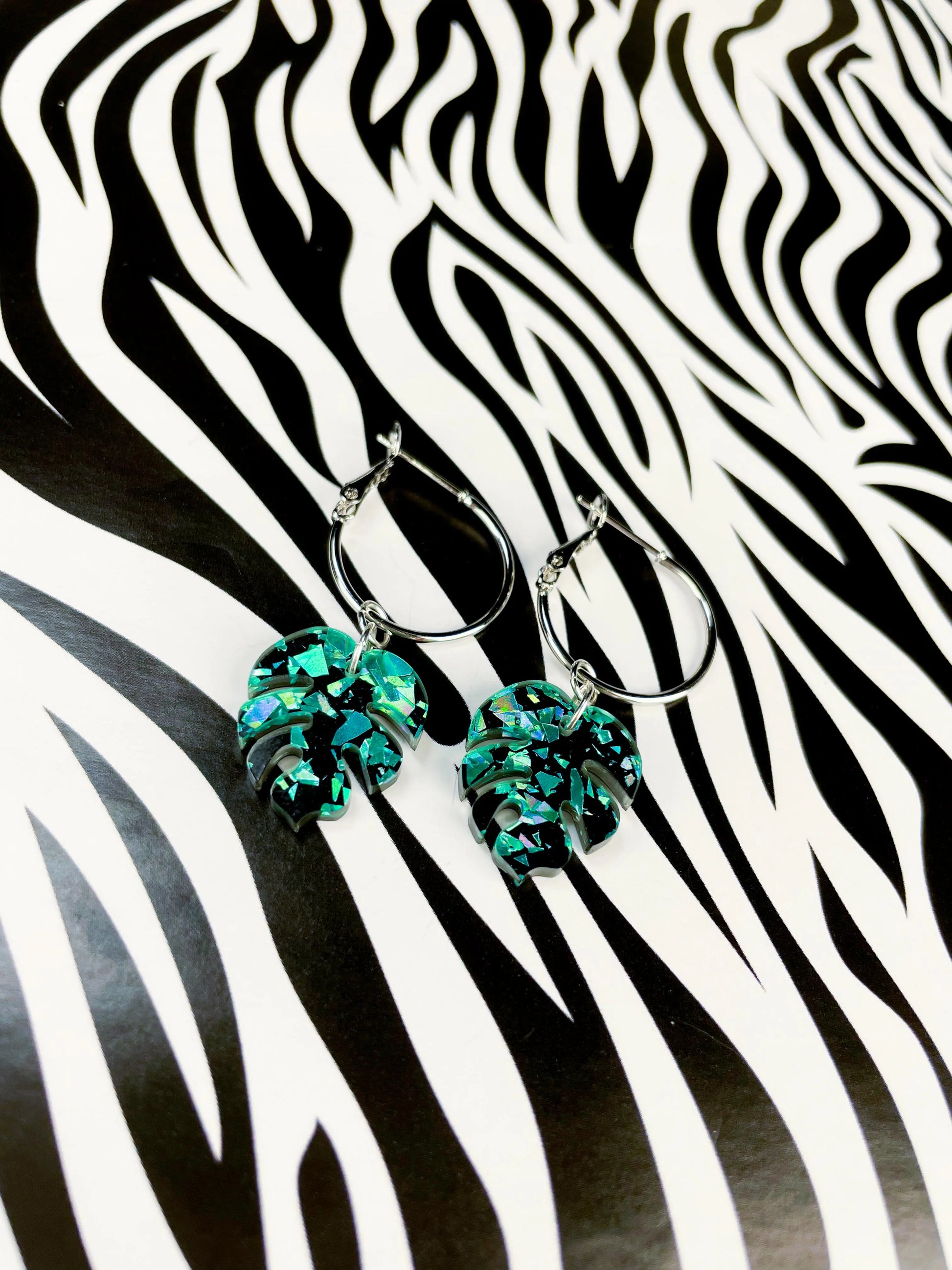 Small Teal Chunky Crystal Glitter Acrylic Monstera Leaf Dangle Earrings from Sapphire Frills